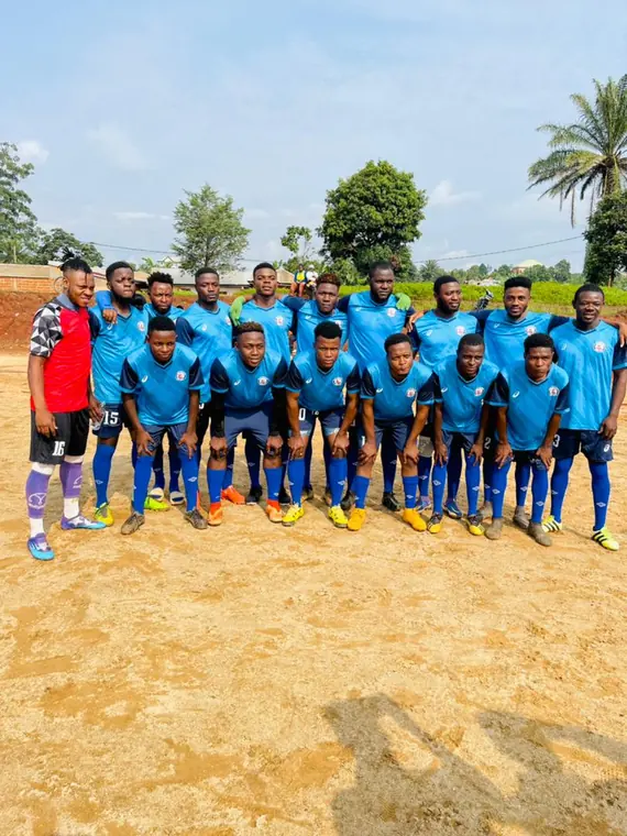 The team posing together in blue